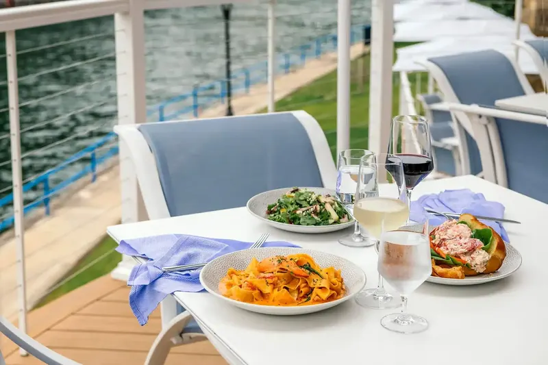 Plates and drinks on a patio table outdoors